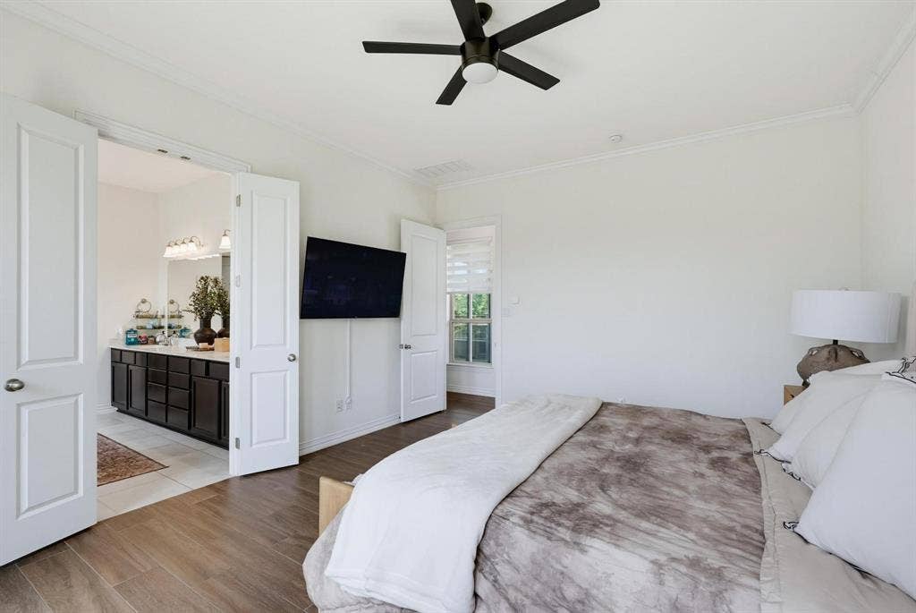 1205 Shady Fox Way, Arlington, TX 76005 Bedroom with wood-finish flooring and a ceiling fan