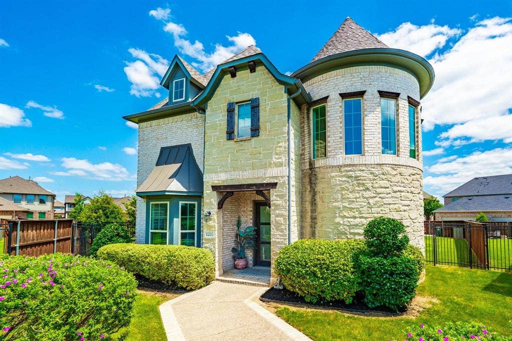 1205 Shady Fox Way, Arlington, TX 76005 Stone and brick exterior featuring a prominent turretted section with multiple windows