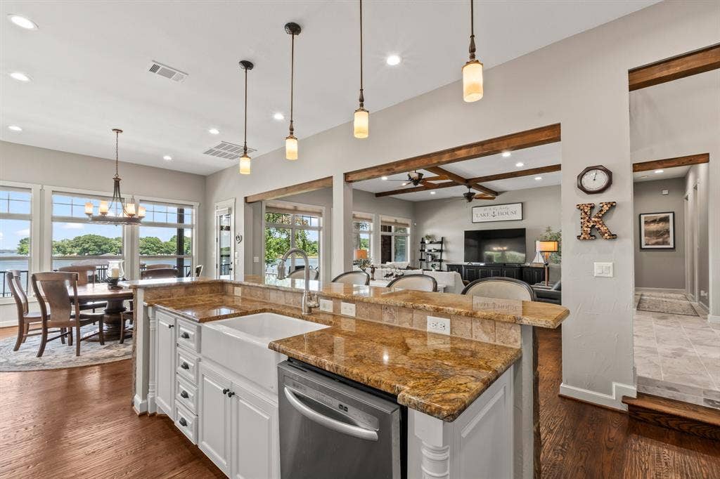 229 N Beverly Drive, Malakoff, TX 75148 The expansive island with large single basin sink, stainless appliances, and granite countertops.