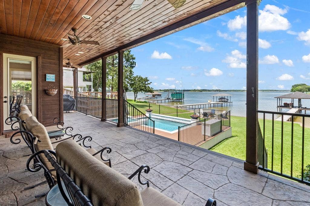 229 N Beverly Drive, Malakoff, TX 75148 Elevated covered patio overlooking the pool, backyard, and open-water views.