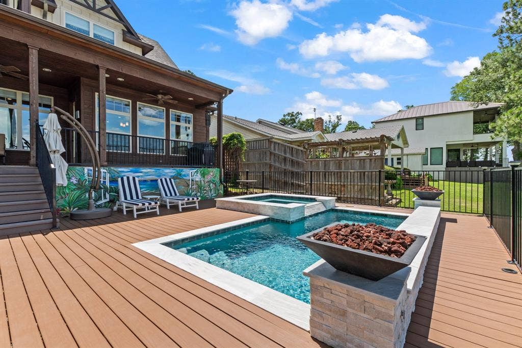 229 N Beverly Drive, Malakoff, TX 75148 Enjoy lake life year round with the heated pool and spa framed by fire features and open water views.