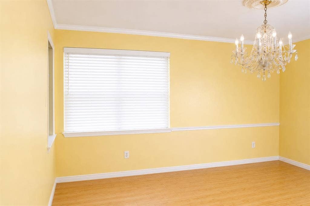 1630 Indian Summer Trail, Dallas, TX 75241 Room featuring wood-finish flooring, a large window with blinds, and white trim molding