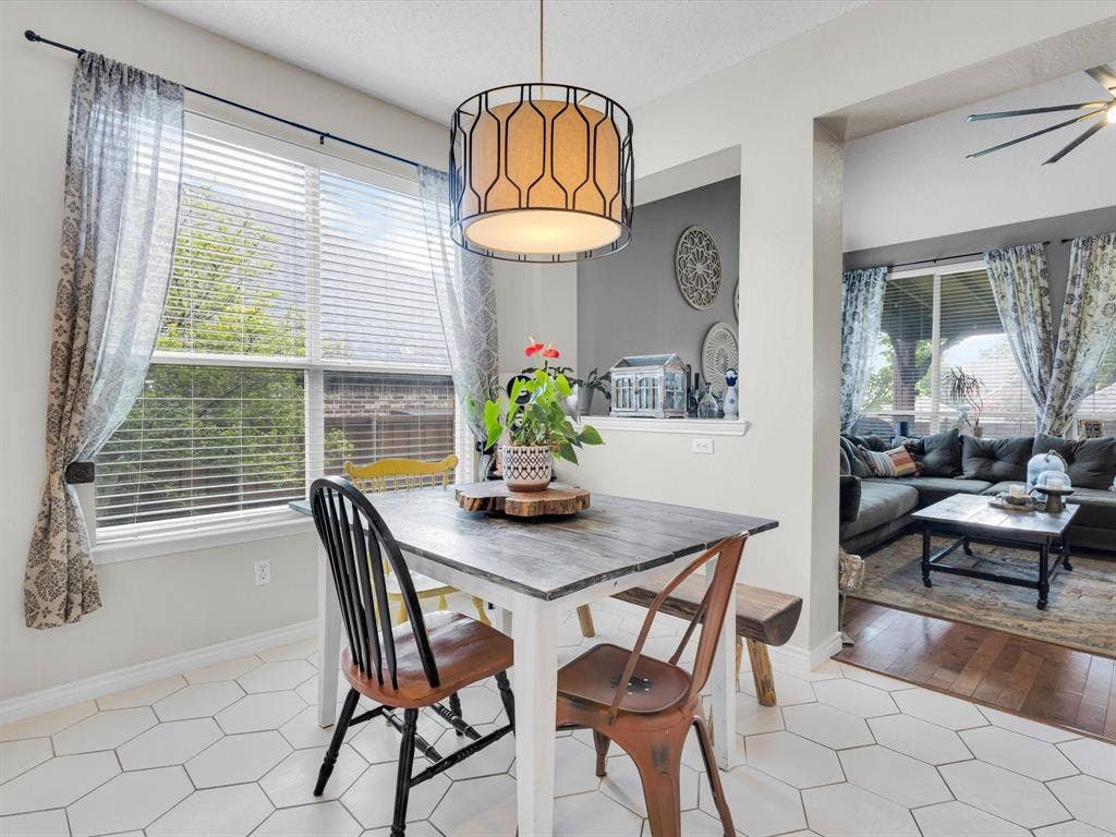 6004 Crestmill Lane, Sachse, TX 75048 Dining area featuring white hexagonal tile flooring and a decorative overhead light fixture