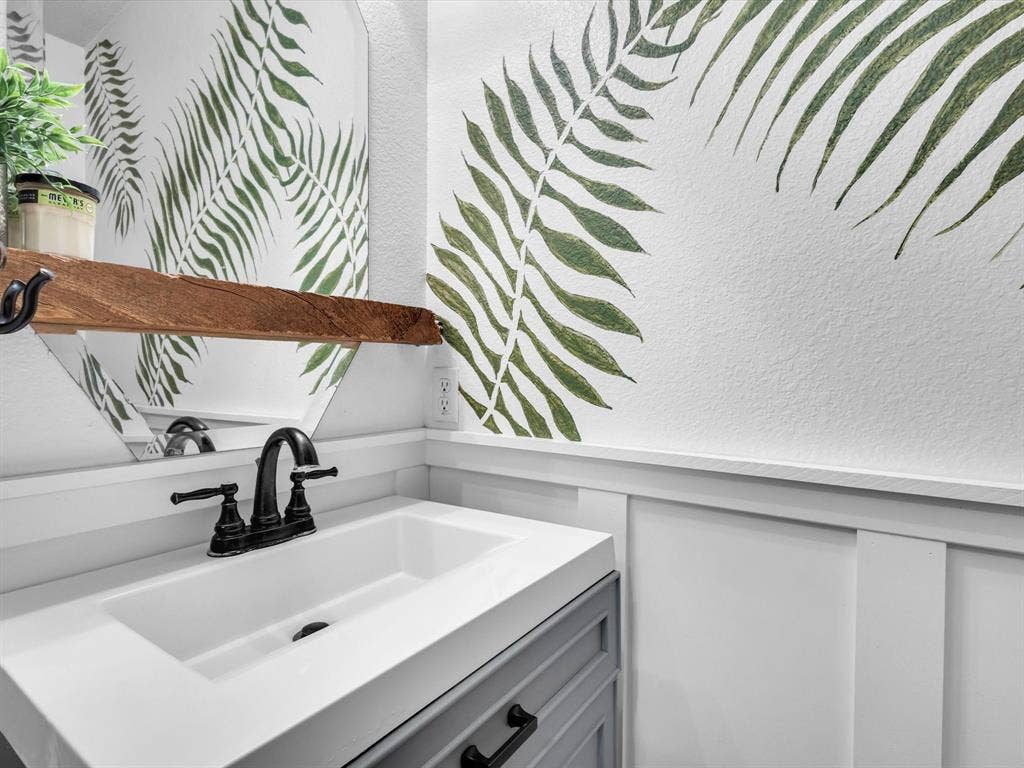 6004 Crestmill Lane, Sachse, TX 75048 Half bath on first floor just off of the living room.