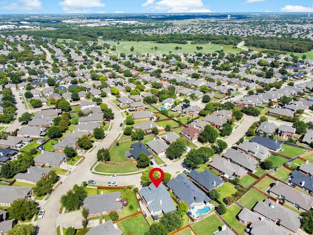 6004 Crestmill Lane, Sachse, TX 75048 Aerial overview of a residential neighborhood with numerous single-family homes