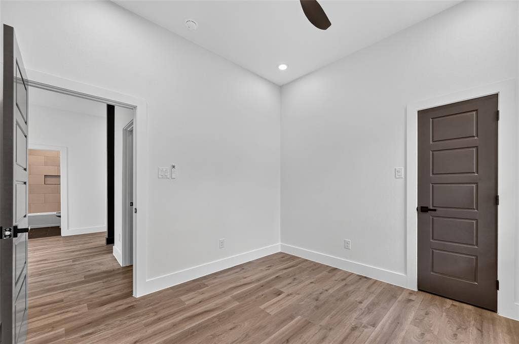 5130 Echo Avenue, Dallas, TX 75215 Interior room with wood-finish flooring, white walls, recessed lighting, and a ceiling fan