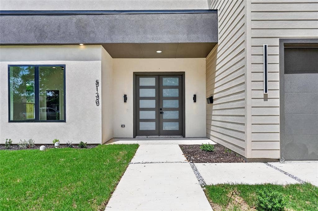 5130 Echo Avenue, Dallas, TX 75215 Contemporary architectural facade featuring a double entry door with frosted glass panels, smooth stucco finishes, and horizontal siding