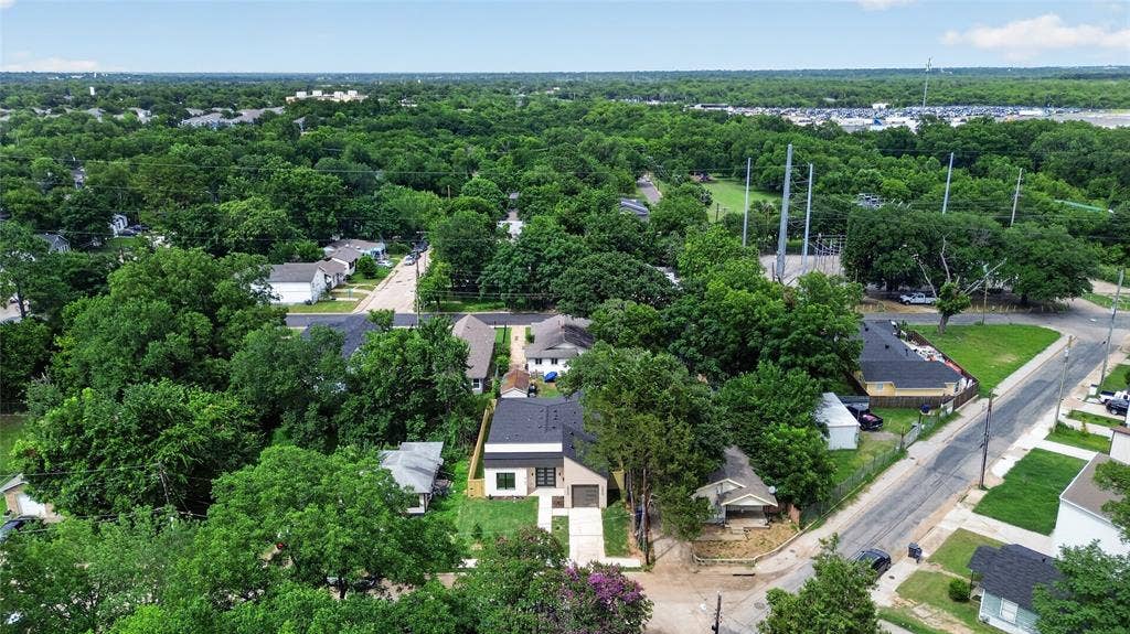 5130 Echo Avenue, Dallas, TX 75215 Modern residential property featuring a dark-toned roof and a light-colored facade