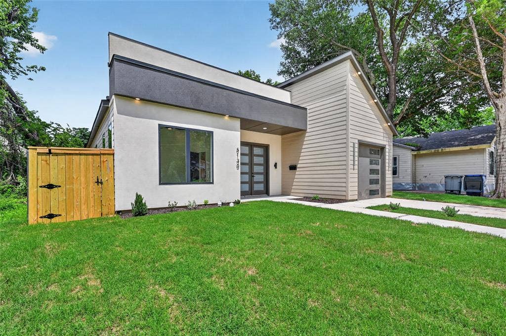 5130 Echo Avenue, Dallas, TX 75215 Contemporary exterior featuring a flat roofline, stucco facade, and horizontal siding accents