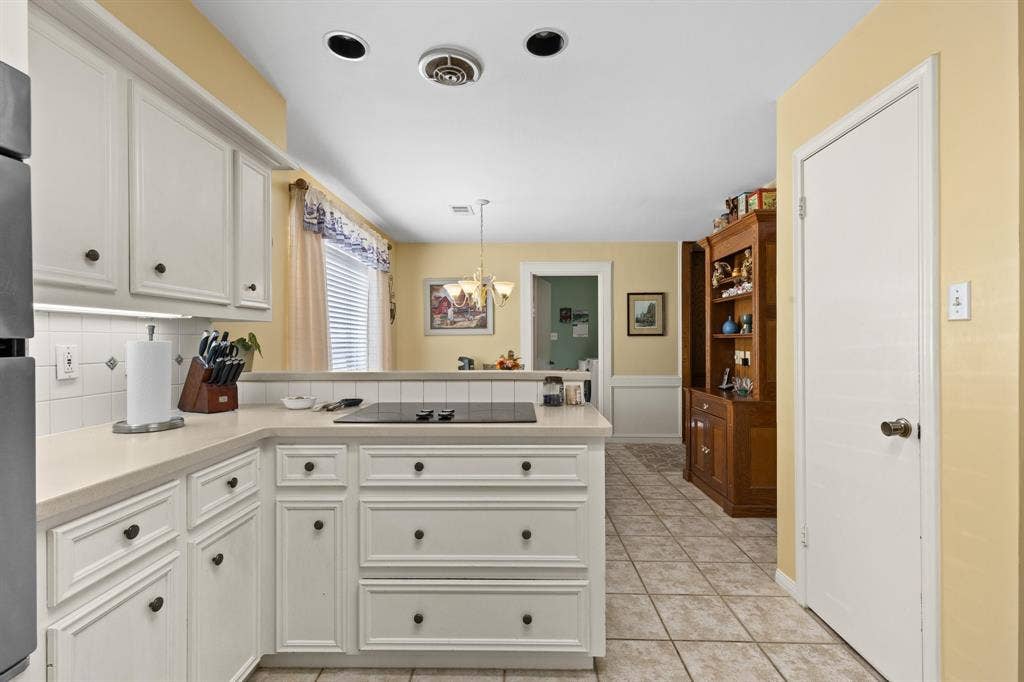 5602 Fountainbridge Ln, Houston, TX 77069 Kitchen has recessed lighting, KitchenAid appliances, pot & pans storage, electric cooktop, double oven