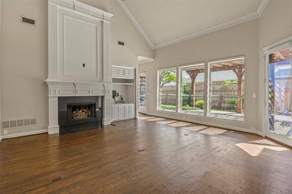5812 Kingsbrook Drive, Plano, TX 75093 Vaulted ceiling and a wall of windows to the patio.