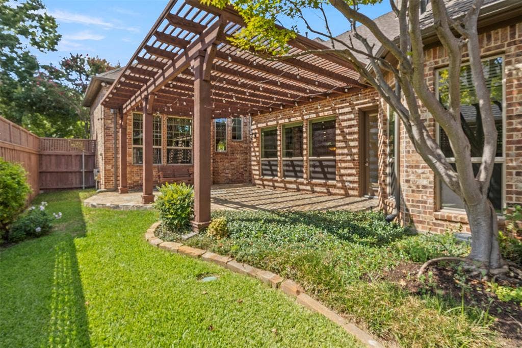 5812 Kingsbrook Drive, Plano, TX 75093 Easy care yard with stone patio and pergola.