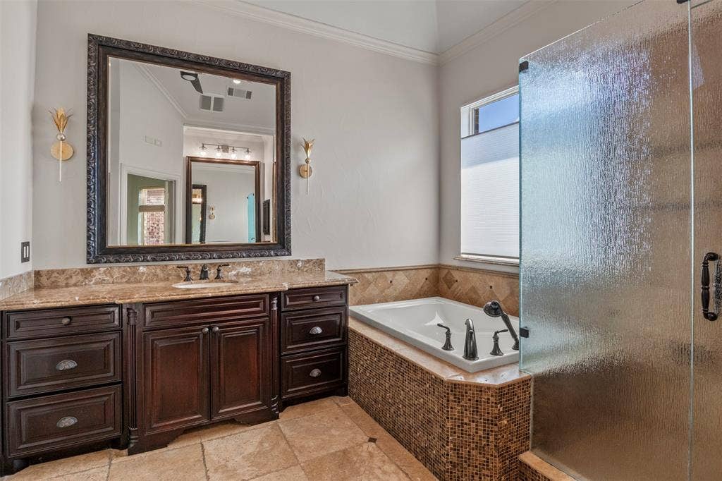 5812 Kingsbrook Drive, Plano, TX 75093 Separate vanities, large window, rain glass shower doors.