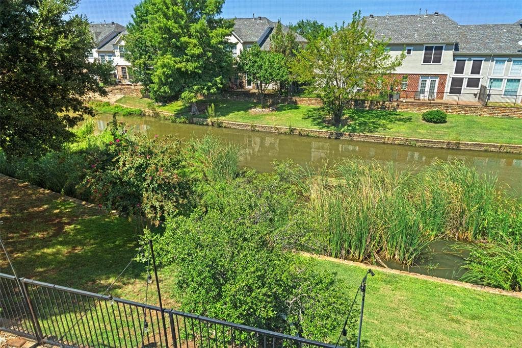 4424 Honfleur Court, Irving, TX 75038 View of green lawn with a water view from your deck! Most of the windows of the townhome share this amazing view!