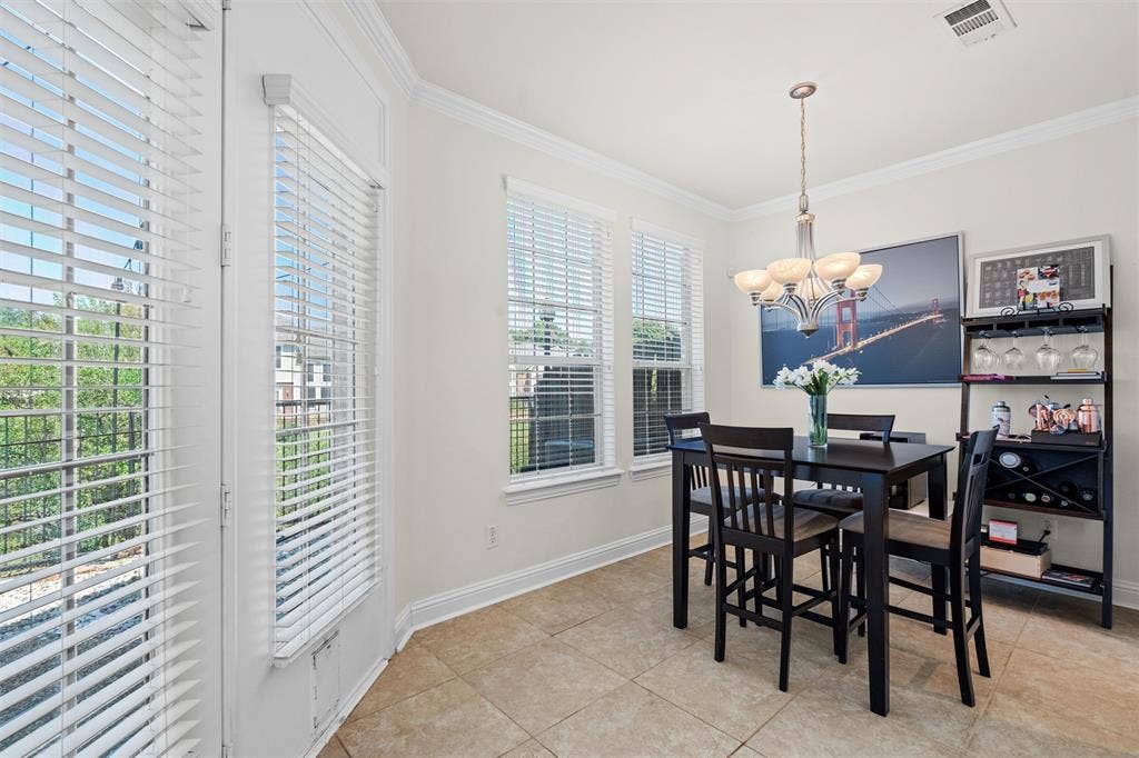 4424 Honfleur Court, Irving, TX 75038 The dining room features tons of natural light and a door to the patio.