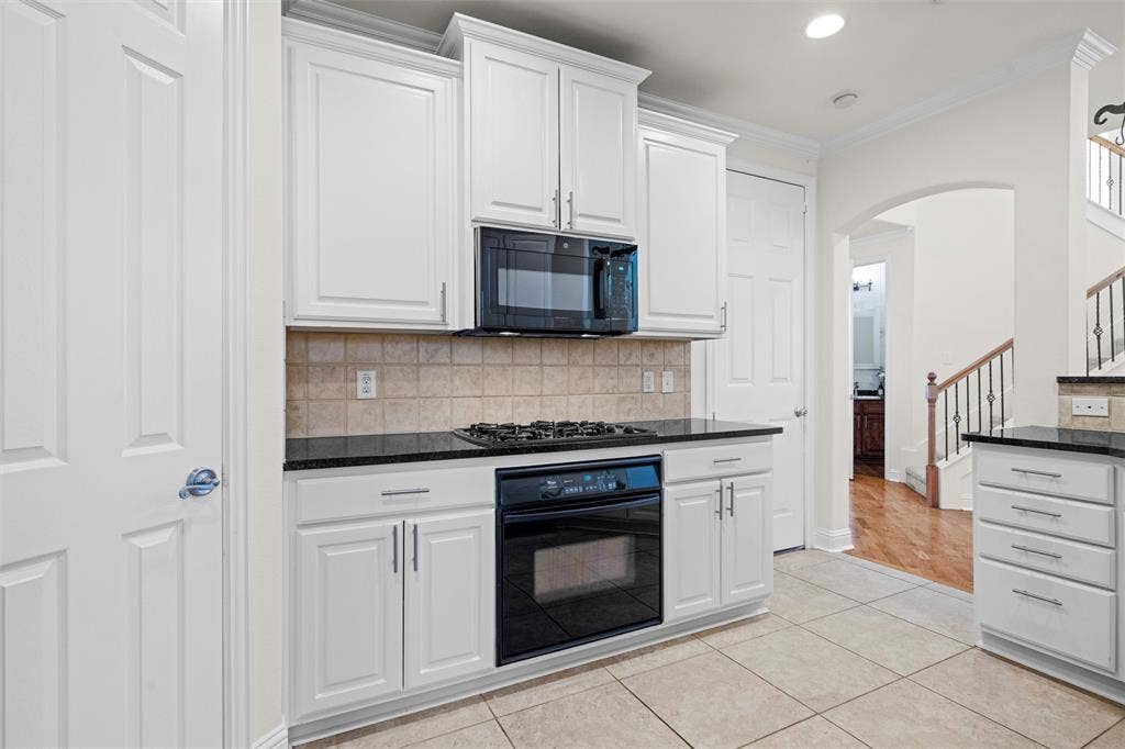 4424 Honfleur Court, Irving, TX 75038 Not only does the kitchen have a lot of cabinets, but it also features a nice sized walk-in pantry!