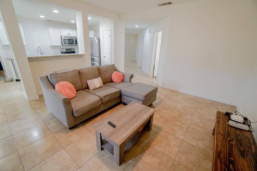 203 Grassy Creek Drive, Wylie, TX 75098 Open concept living area with light-toned tile flooring