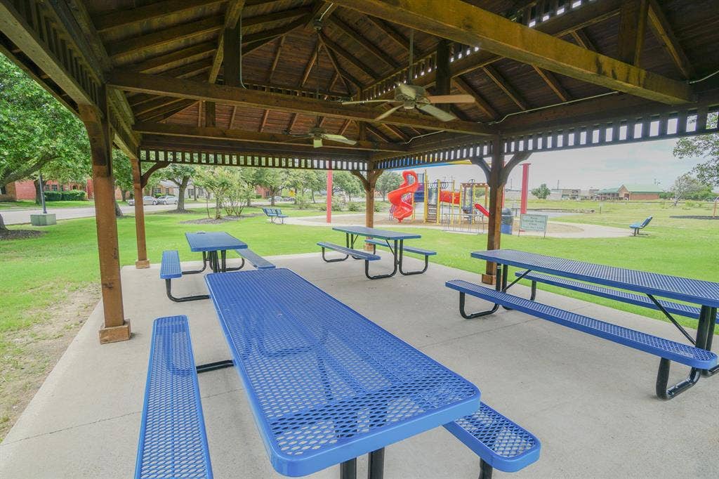 203 Grassy Creek Drive, Wylie, TX 75098 Spacious wooden gazebo featuring a slatted roof and concrete flooring