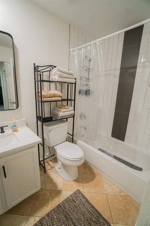 203 Grassy Creek Drive, Wylie, TX 75098 Bathroom featuring a white vanity with a single basin sink, matte black faucet, and white countertop