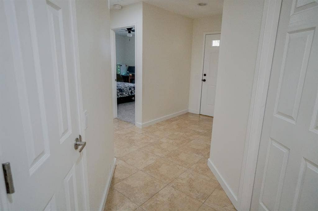 203 Grassy Creek Drive, Wylie, TX 75098 Tiled entryway featuring a panel door with a clear glass insert and a second panel door with a satin nickel handle