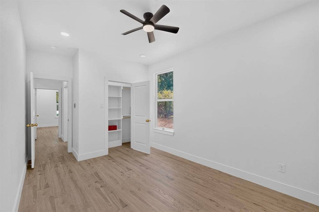 343 SCHOONER Road, Gun Barrel City, TX 75156 Light wood-finish flooring complements the crisp white walls and trim