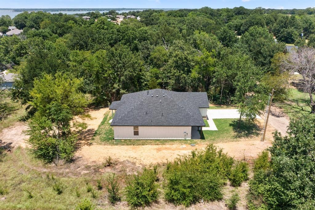 343 SCHOONER Road, Gun Barrel City, TX 75156 New construction single-story home with light-colored siding and a dark shingled roof
