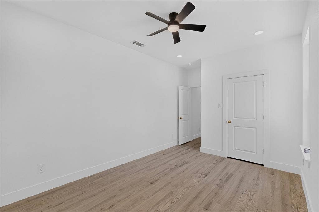 343 SCHOONER Road, Gun Barrel City, TX 75156 Room featuring wood-finish flooring, white walls, and a contemporary ceiling fan