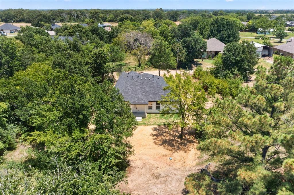 343 SCHOONER Road, Gun Barrel City, TX 75156 Single-story residence featuring a dark shingle roof and light-colored siding