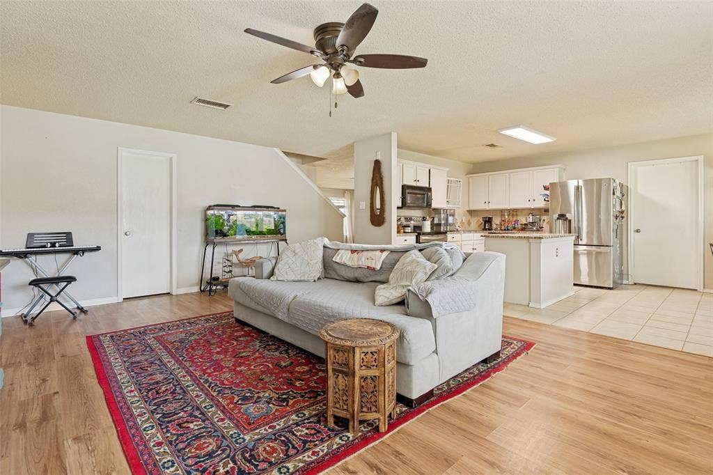 605 Rock Brook Drive, Forney, TX 75126 Open-concept living space featuring wood-finish flooring