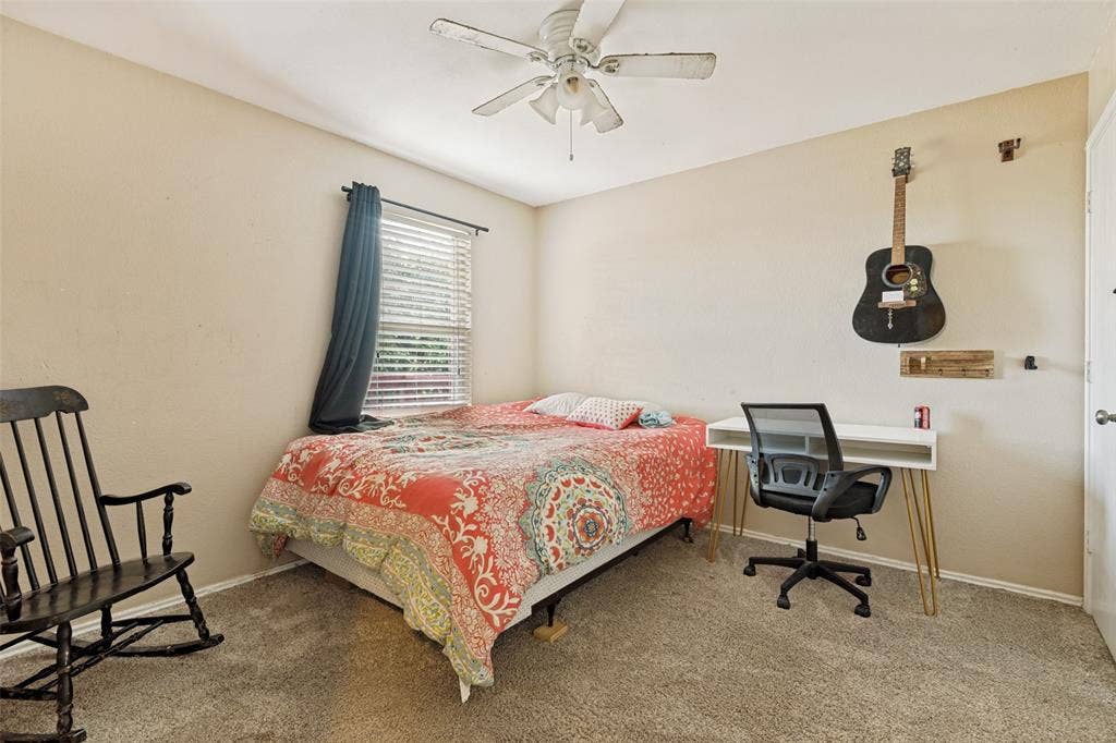 605 Rock Brook Drive, Forney, TX 75126 Carpeted interior room featuring a ceiling fan, a window with blinds, and light-toned walls