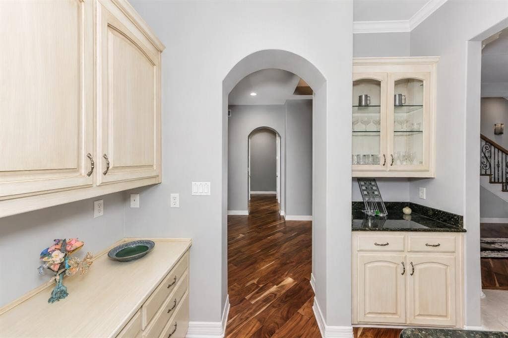 5974 River Bend Drive, Benbrook, TX 76132 View of dry bar and built in desk by formal dining area