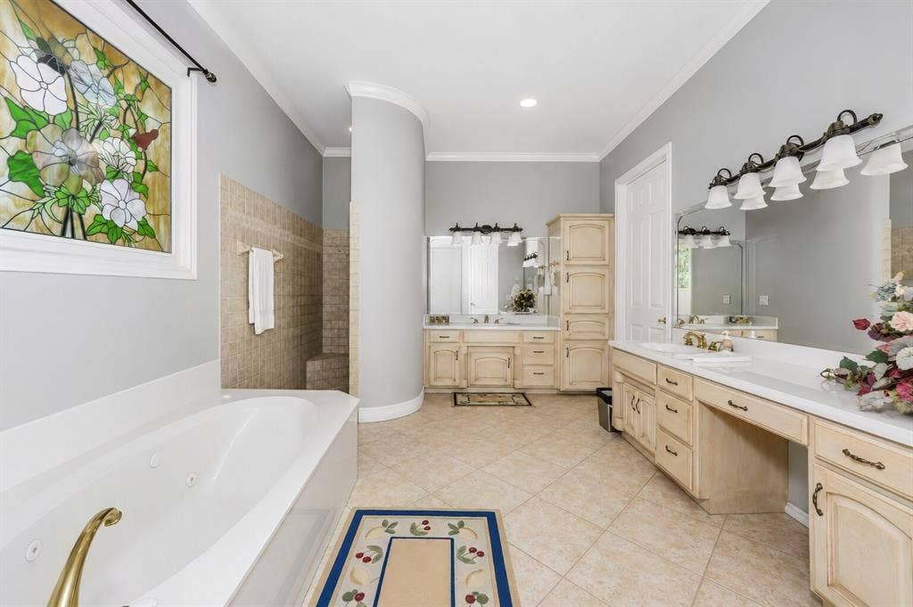 5974 River Bend Drive, Benbrook, TX 76132 Primary ensuite bath one on first level.