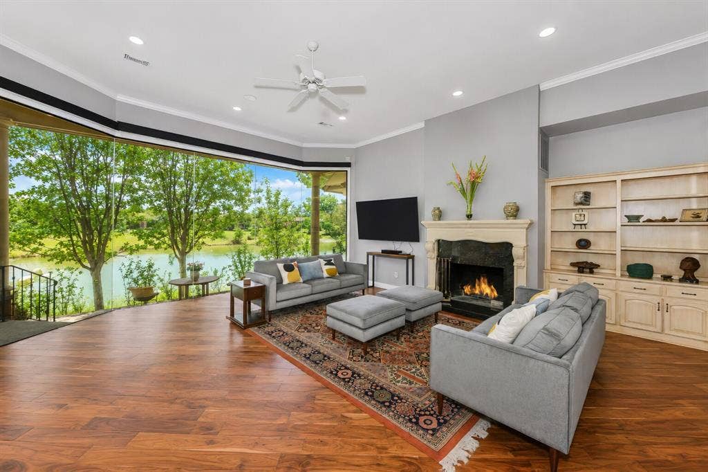 5974 River Bend Drive, Benbrook, TX 76132 Large windows offer electric shades
