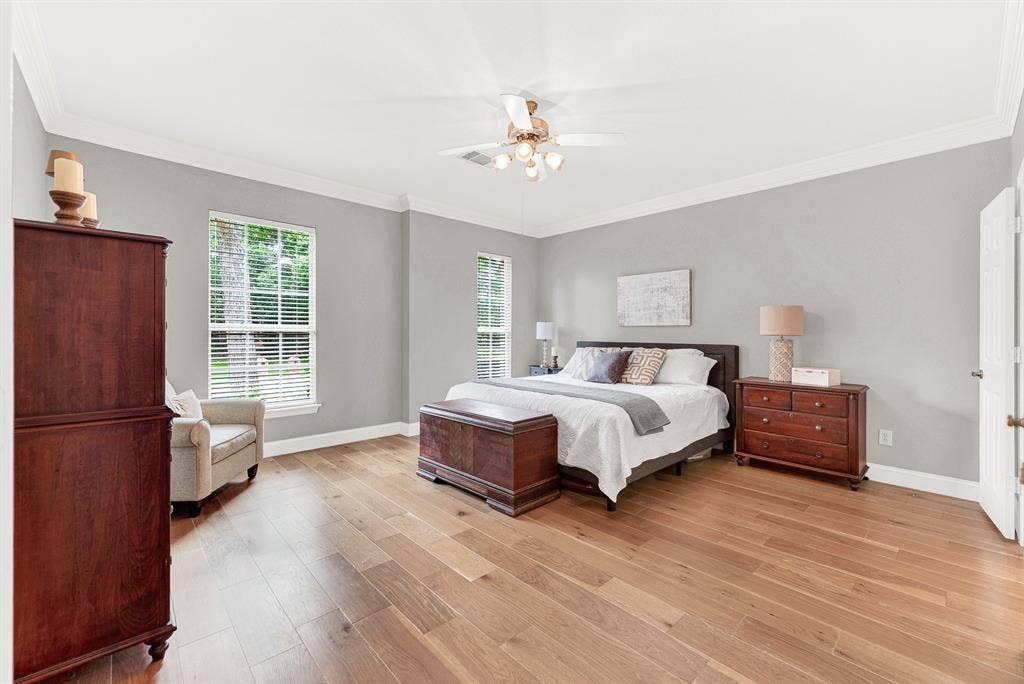 3708 Stockport Drive, Plano, TX 75025 Generous crown molding frames the soaring ceiling, enhancing the open and airy layout. Imagine waking up to soft morning light filtering through the tall windows.