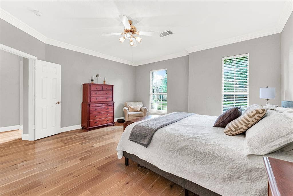 3708 Stockport Drive, Plano, TX 75025 Rich wood flooring anchors the expansive walls, catching the sunlight beautifully. Picture yourself unwinding here after a long day as the afternoon sun recedes.