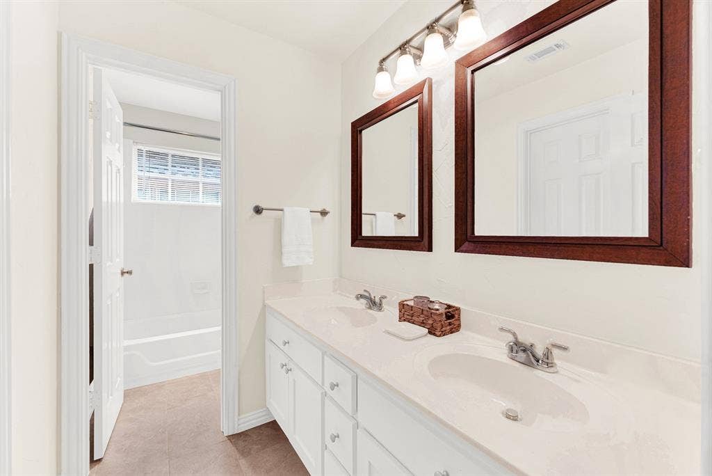 3708 Stockport Drive, Plano, TX 75025 The dual vanity setup maximizes counter space and connects seamlessly to a private, separate shower and bath area. Getting ready for the day becomes effortless when two people have their own designated space.