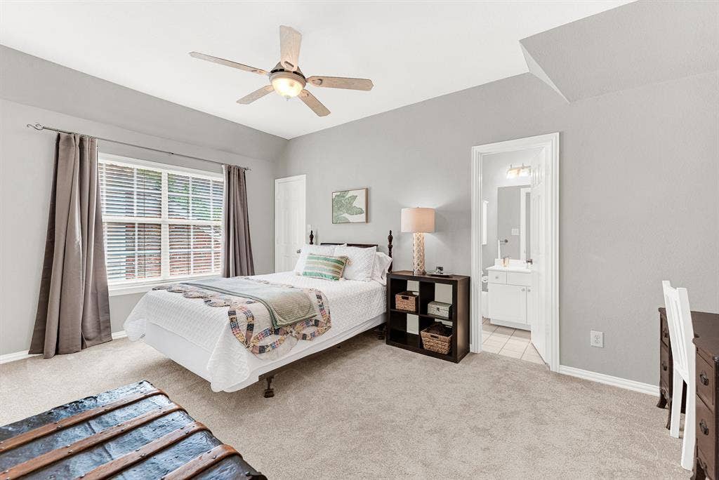 3708 Stockport Drive, Plano, TX 75025 A wide window illuminates the soft palette of this space, while a private ensuite doorway ensures absolute convenience. Guests will love waking up to a bright, peaceful morning before starting their day in total privacy
