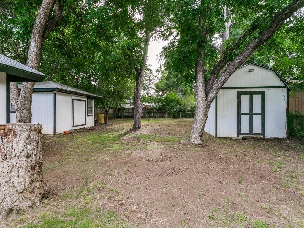 429 Harmon Road, Hurst, TX 76053 HUGE back yard with storage sheds