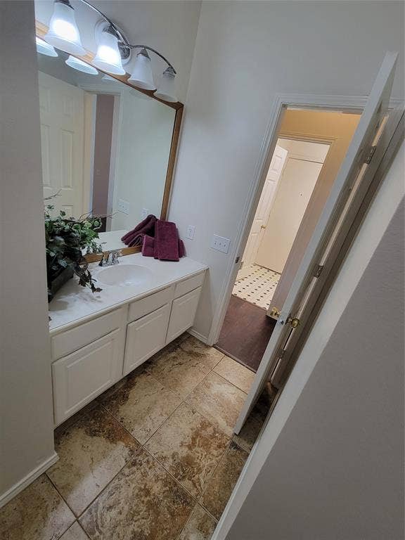 Full bathroom with vanity, tiled shower / bath, toilet, and tile flooring