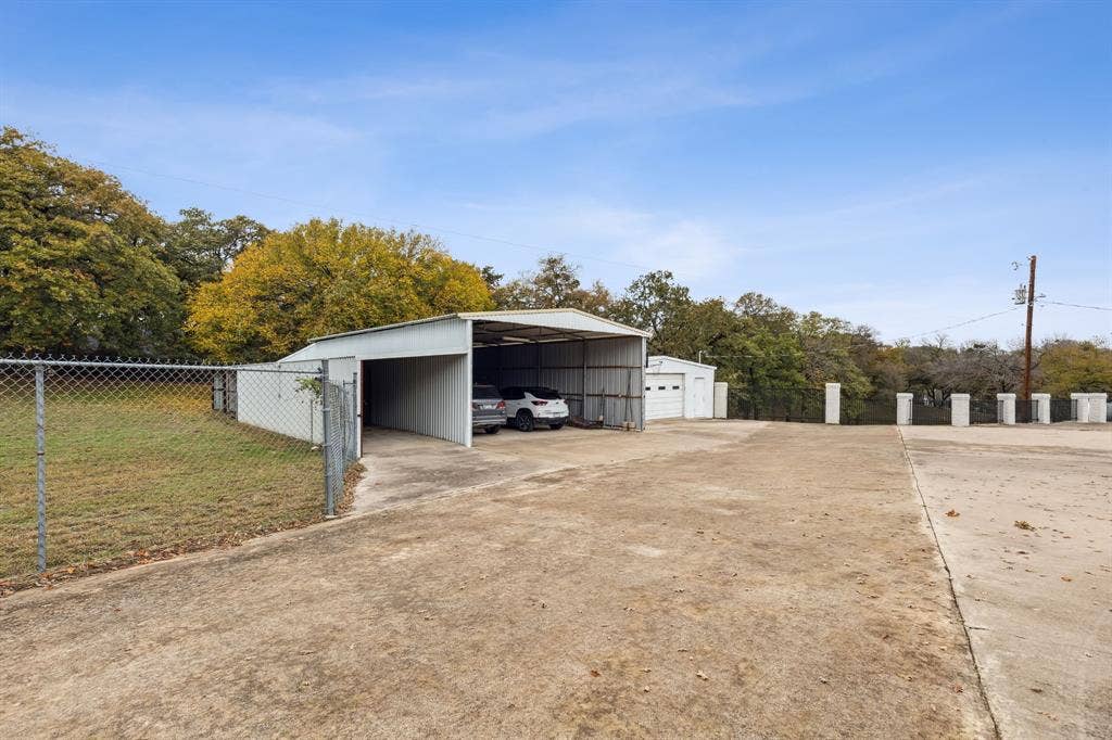 7342 Briar Road, Azle, TX 76020 Hangar to park boat / RV / Cars, and garage / workshop. Total of over 4,400 square feet of space