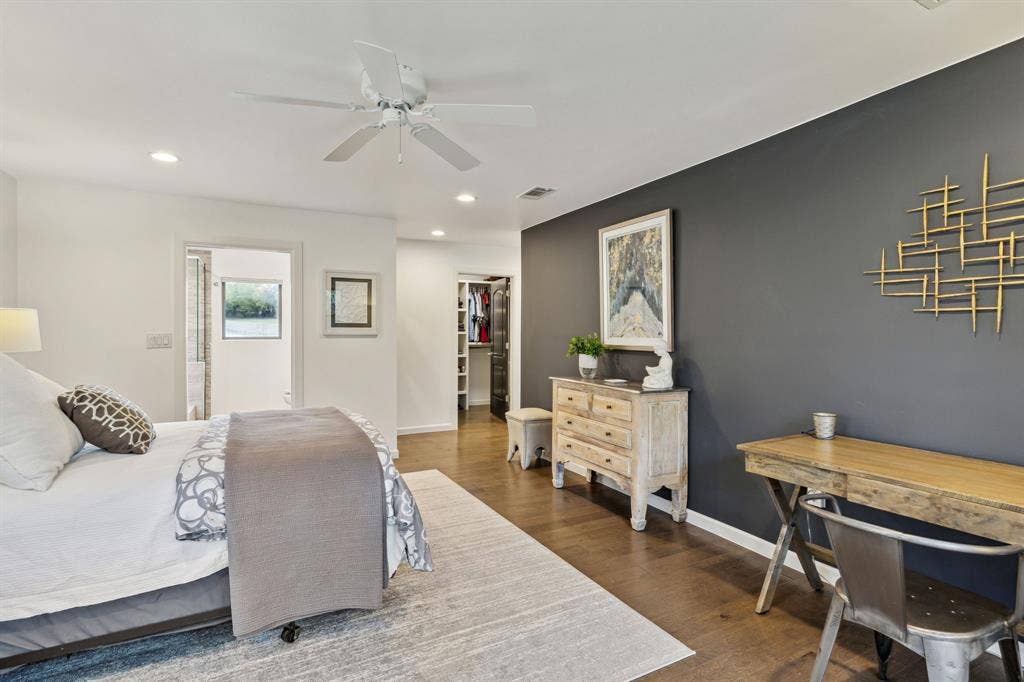 7342 Briar Road, Azle, TX 76020 Bedroom featuring a custome walk-in closet, ceiling fan, a spacious closet, and dark wood-type flooring
