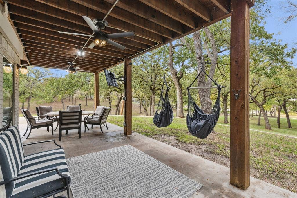 7342 Briar Road, Azle, TX 76020 Covered porch right outside of the kitchen area provides shade from the sun and beautfiul veiws of the land and water