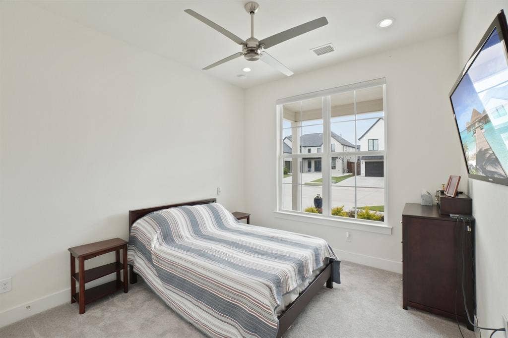 3960 Medio Creek Drive, Prosper, TX 75078 Bright room featuring a large window, recessed lighting, and a ceiling fan