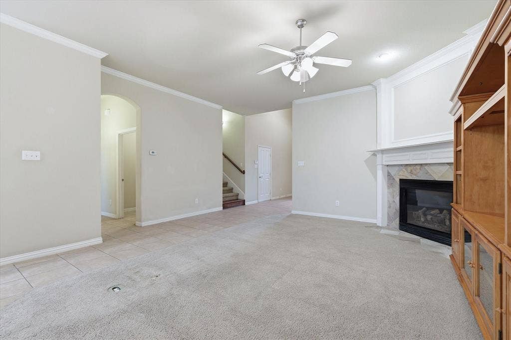 1905 Fountain Meadows Drive, Euless, TX 76039 Large living features a secluded hallway that leads to the laundry room, half bath, and primary suite.