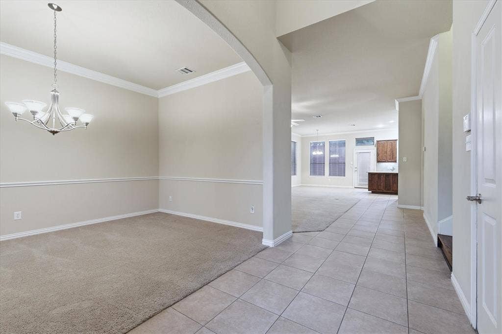 1905 Fountain Meadows Drive, Euless, TX 76039 Entrance flows into the living an dining areas.