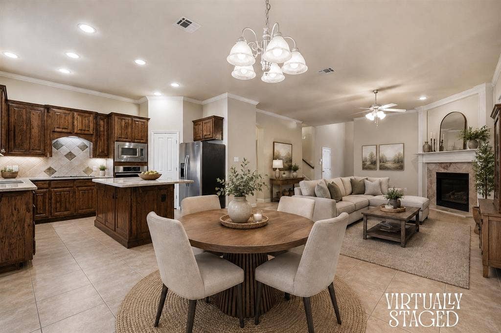 1905 Fountain Meadows Drive, Euless, TX 76039 Virtually staged pen-concept living space with a kitchen, dining area, and living room.