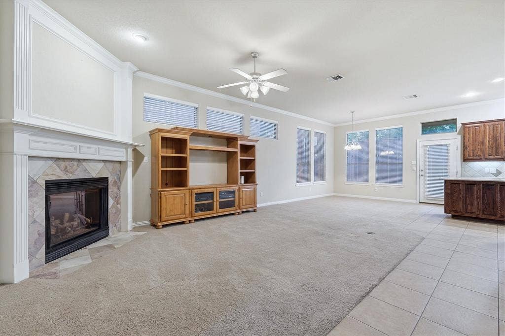 1905 Fountain Meadows Drive, Euless, TX 76039 Spacious living area featuring a gas flip switch fireplace. Open floorplan provides connectivity to the kitchen area and ease in entertaining.