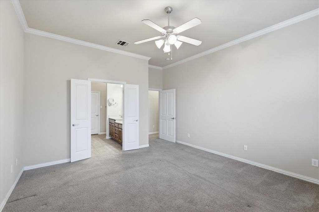 1905 Fountain Meadows Drive, Euless, TX 76039 Spacious first floor primary bedroom opens to the ensuite bath and large walk-in closet.