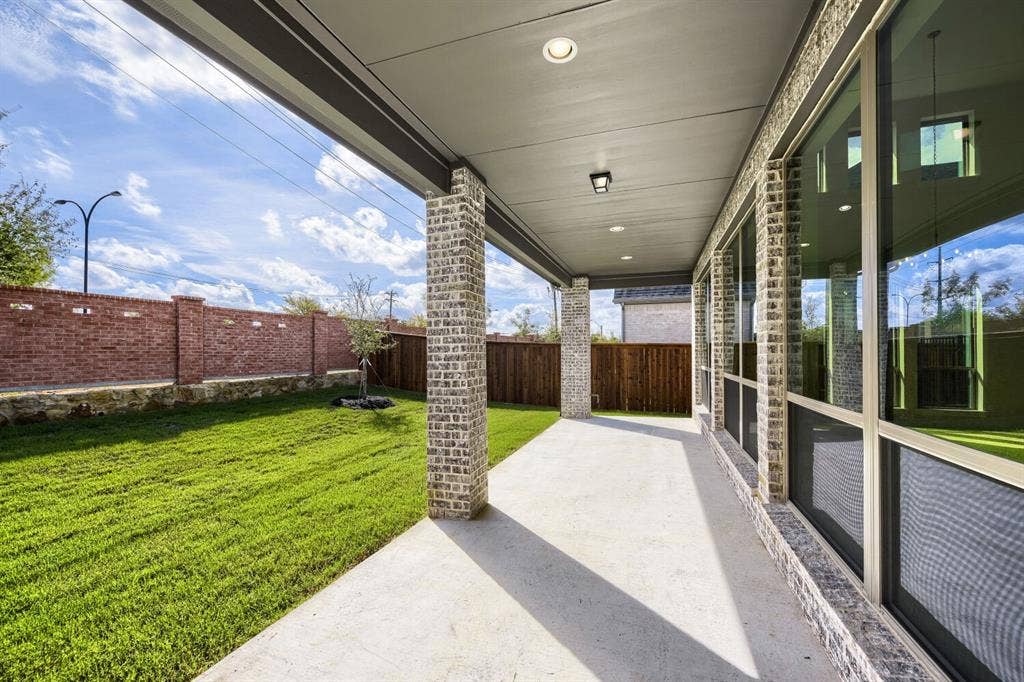 1317 Naples Court, Keller, TX 76248 Covered concrete patio with brick pillars and recessed lighting
