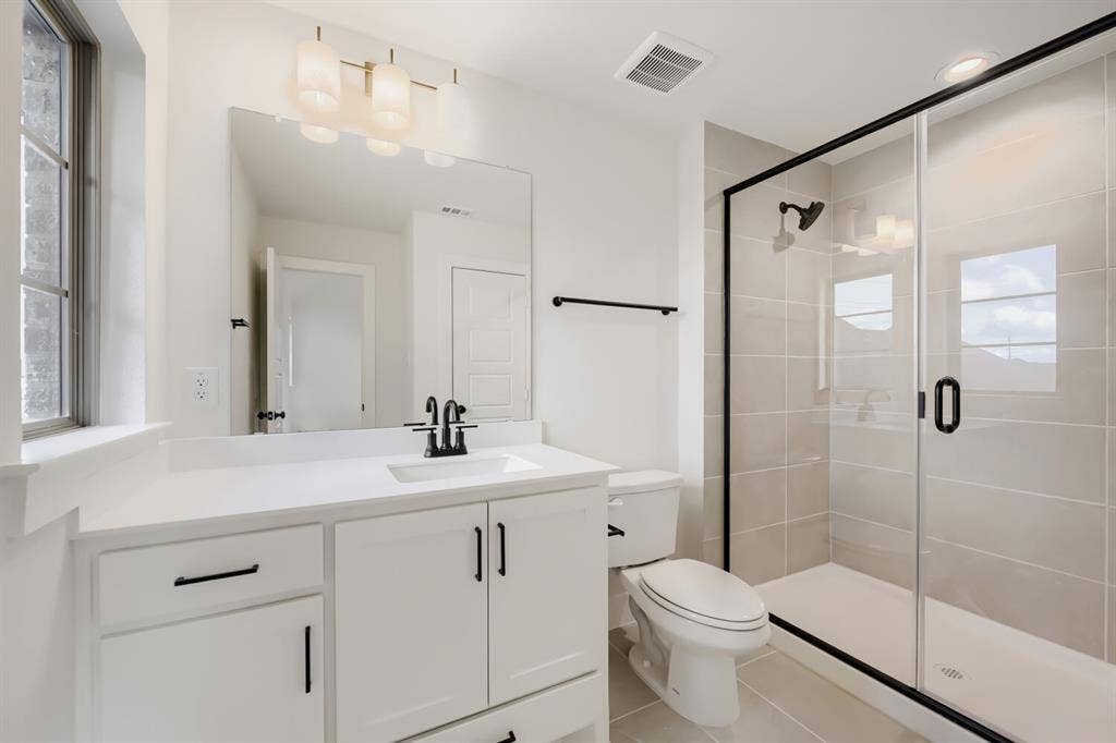 1317 Naples Court, Keller, TX 76248 White vanity with a rectangular sink, black-finish faucet, and a large mirror